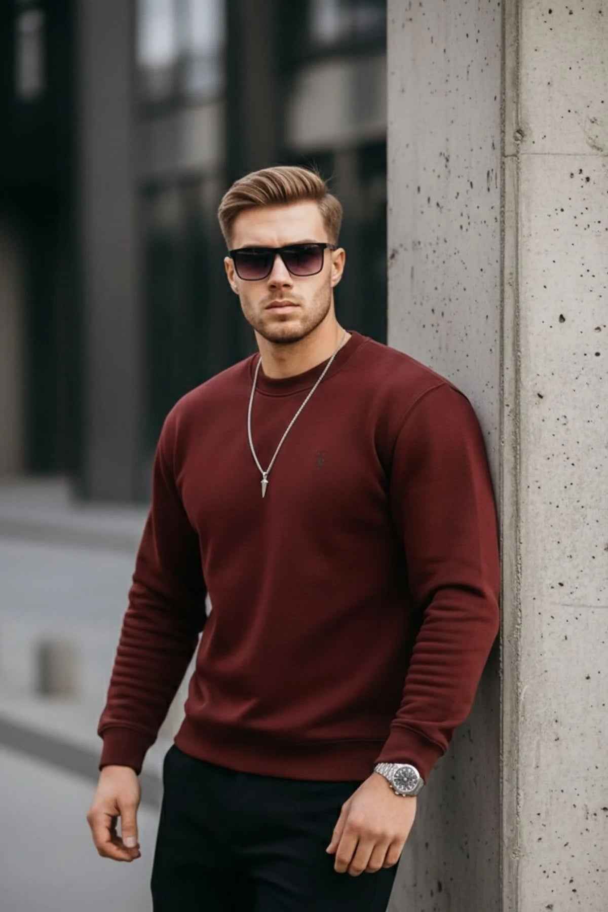 Men's maroon crewneck sweatshirt with small chest logo, long sleeves, relaxed stance