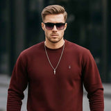 Men's maroon crewneck sweatshirt with small chest logo, long sleeves, front view