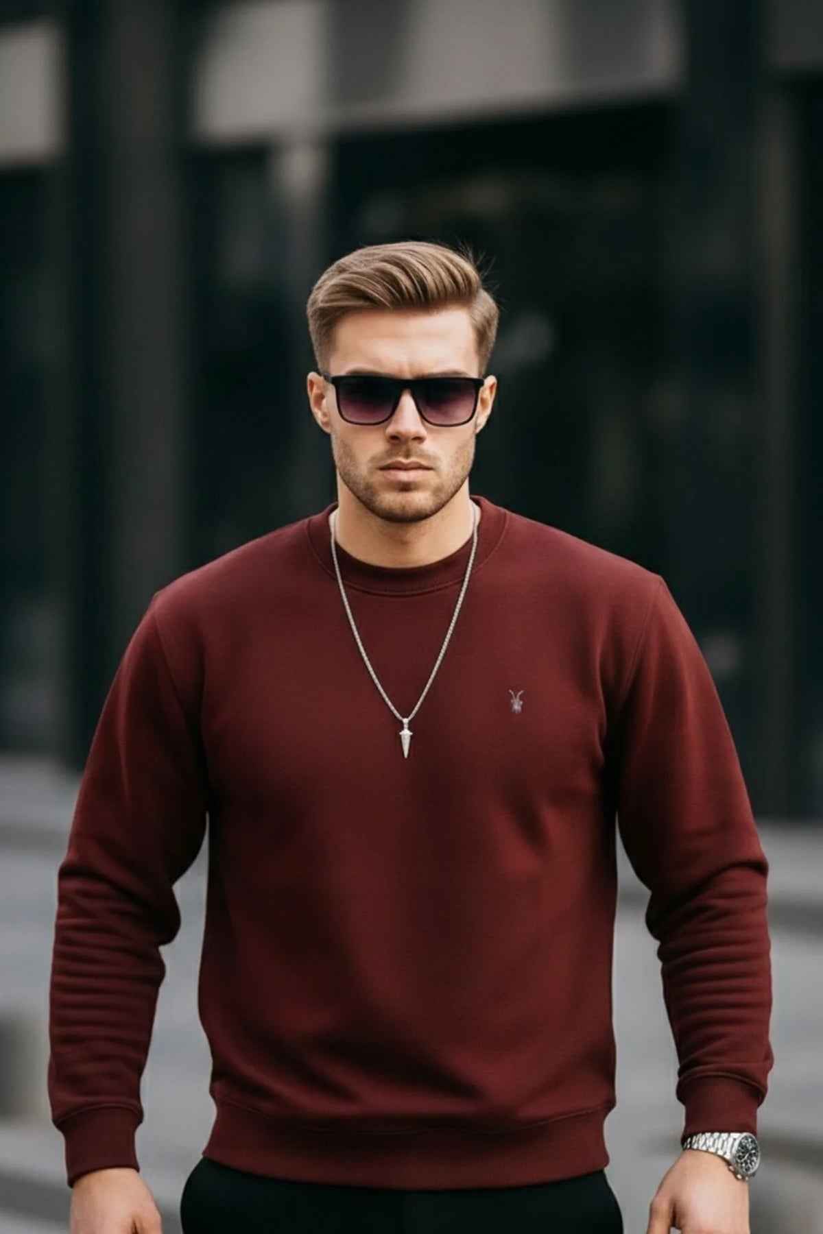 Men's maroon crewneck sweatshirt with small chest logo, long sleeves, front view