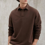 Brown sweatshirt with collared neckline, relaxed fit, side view