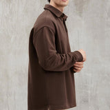 Brown collared sweatshirt with long sleeves, relaxed fit, side profile