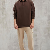 Brown sweatshirt with collared neckline, relaxed fit, front view on model