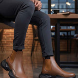 Men's brown ankle boots with dark rubber sole, pull-on style
