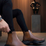 Men's brown ankle boots with dark outsole and side pull-on panels