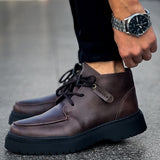 Men's dark brown lace-up ankle boot with side logo patch and thick tread sole