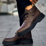 Men's brown lace-up ankle boots with side pull tab and chunky dark tread sole