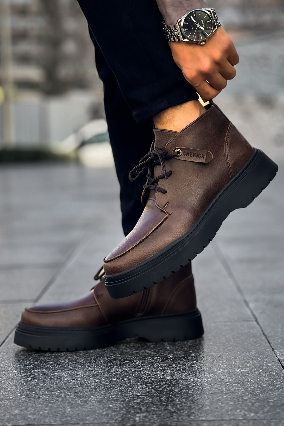 Men's brown lace-up ankle boots with side pull tab and chunky dark tread sole