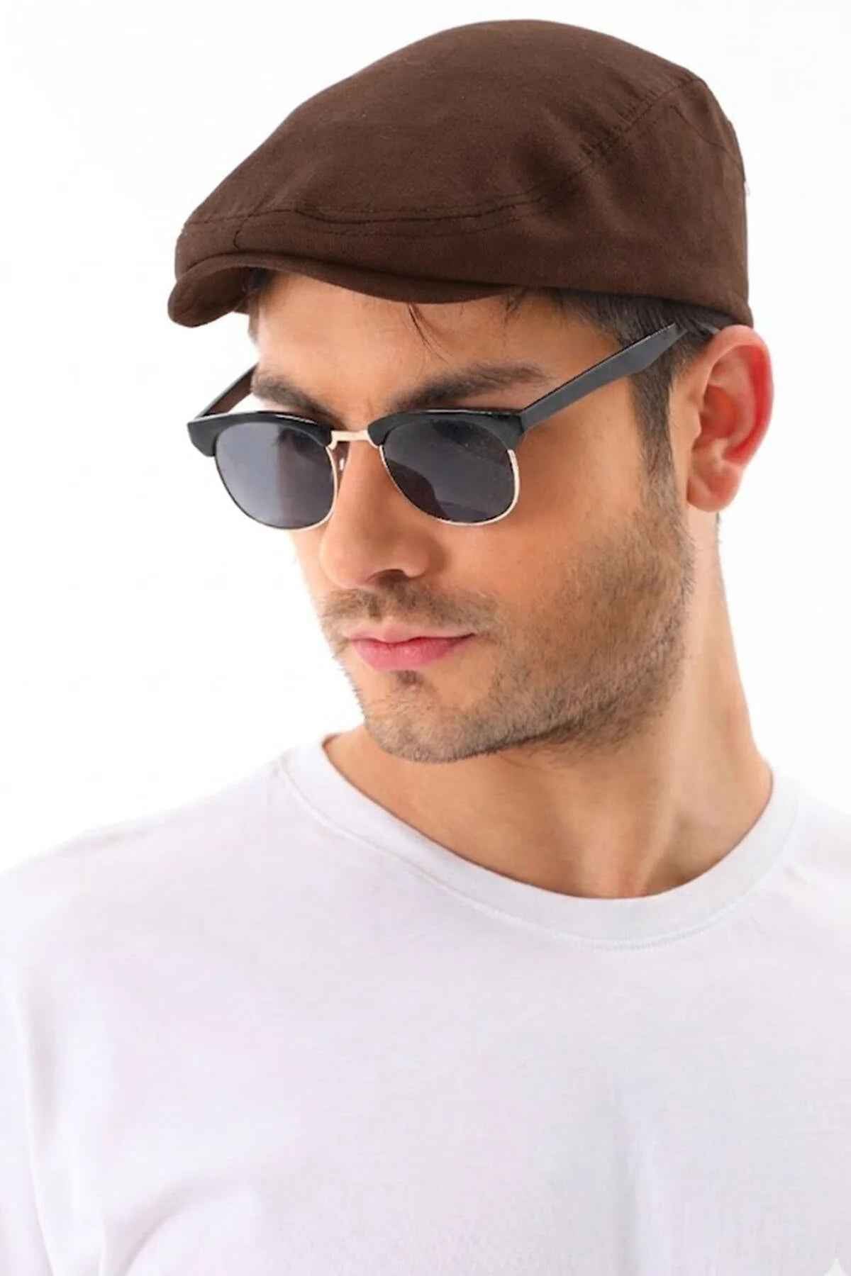 Brown flat cap with curved brim and side stitching
