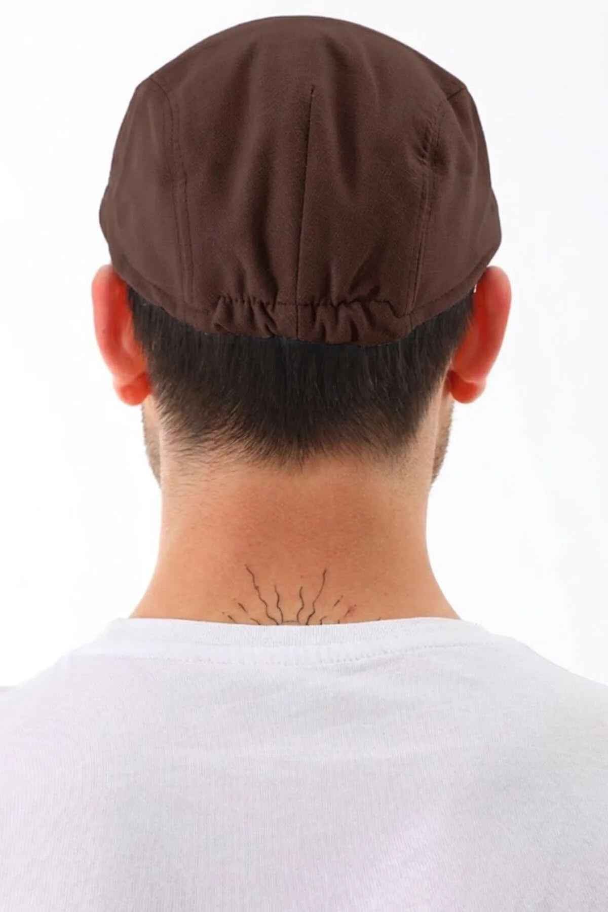 Brown flat cap back view with gathered seam at crown