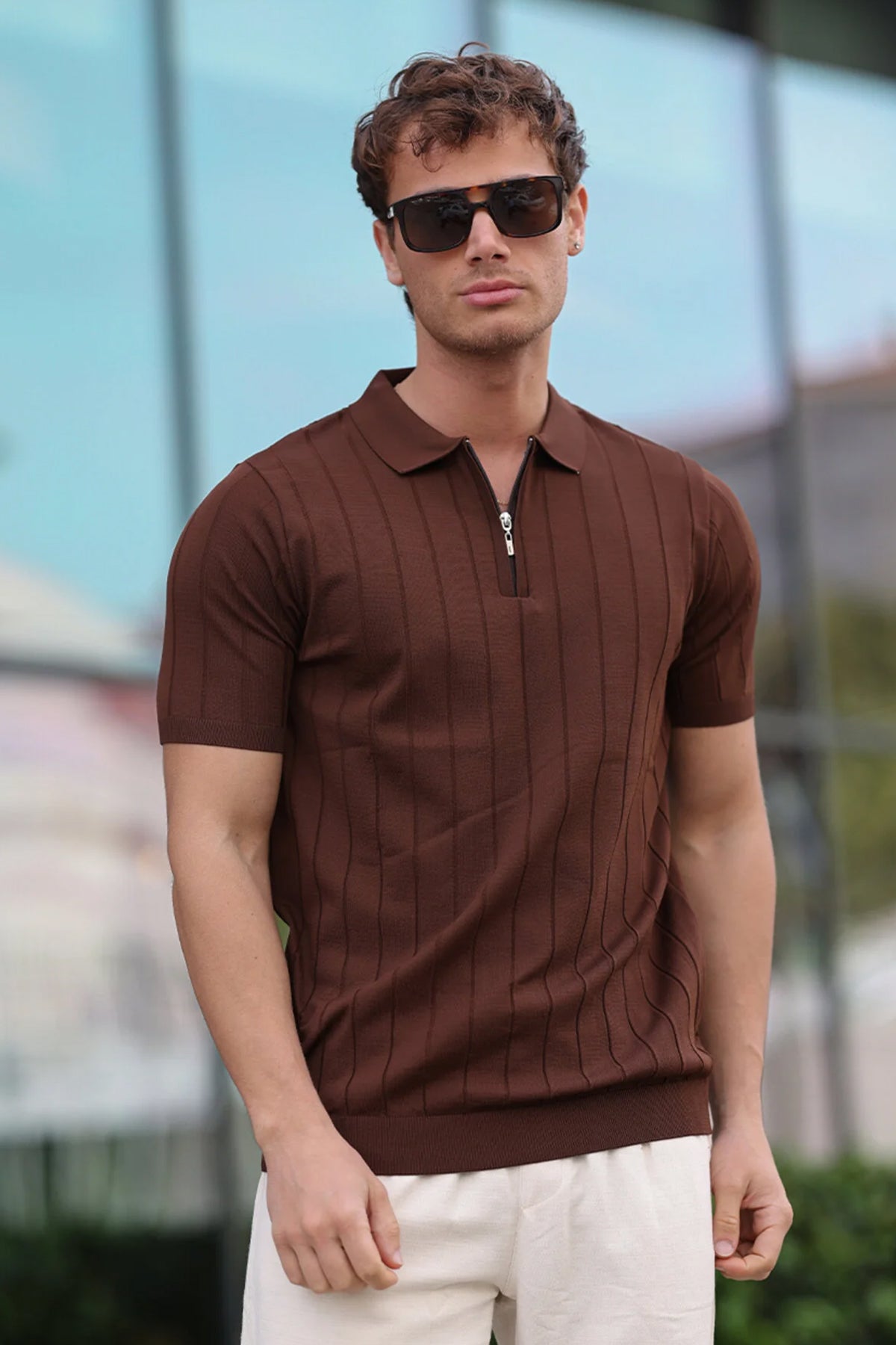 Brown half-zip polo shirt with ribbed placket, short sleeves, vertical stripe texture