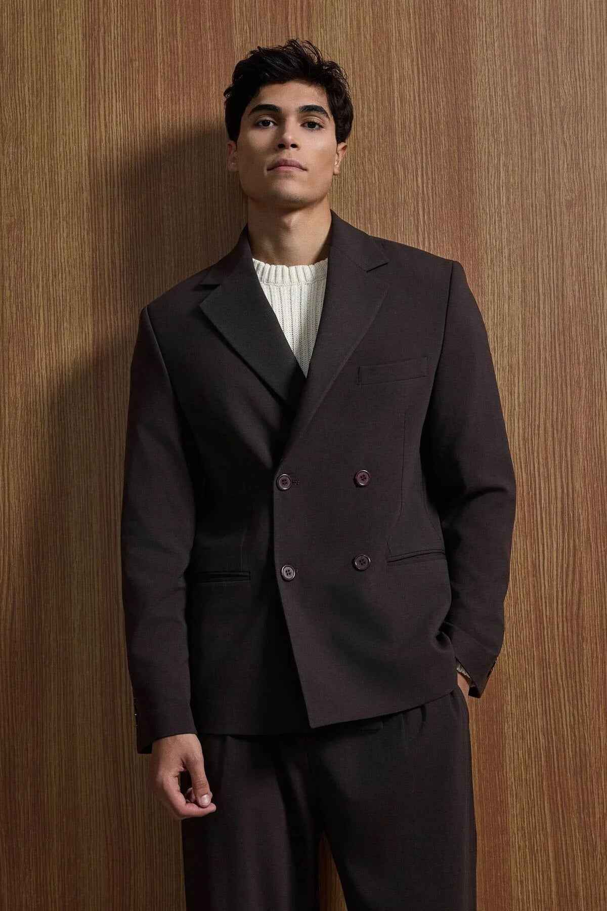 Men's dark brown double-breasted suit jacket with notch lapels and matching trousers
