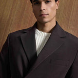 Men's dark brown suit jacket with double-breasted buttons and chest pocket