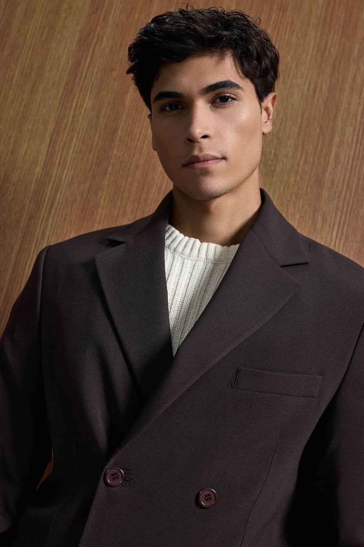 Men's dark brown suit jacket with double-breasted buttons and chest pocket