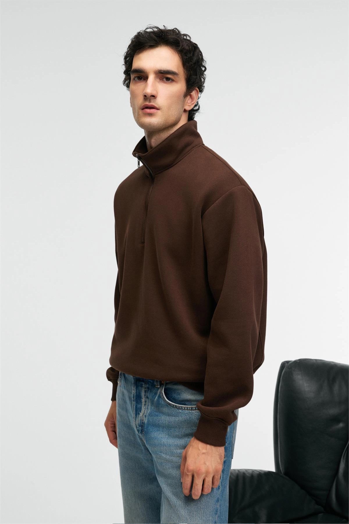 Brown relaxed-fit zip stand-collar sweatshirt, side profile with long sleeves