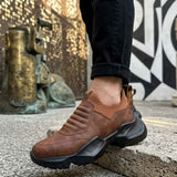 Brown suede slip-on sneakers with textured tread sole and side panels