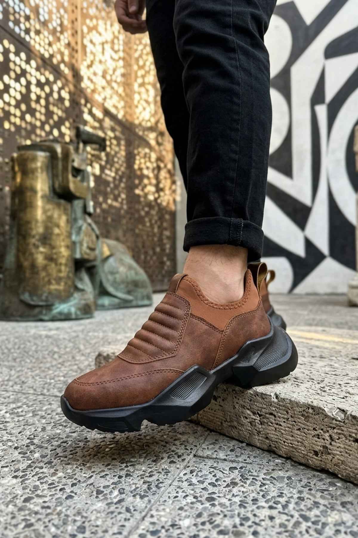 Brown suede slip-on sneakers with textured tread sole and side panels