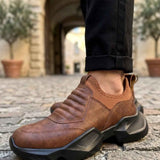 Brown suede sneakers with chunky outsole and elastic side panels