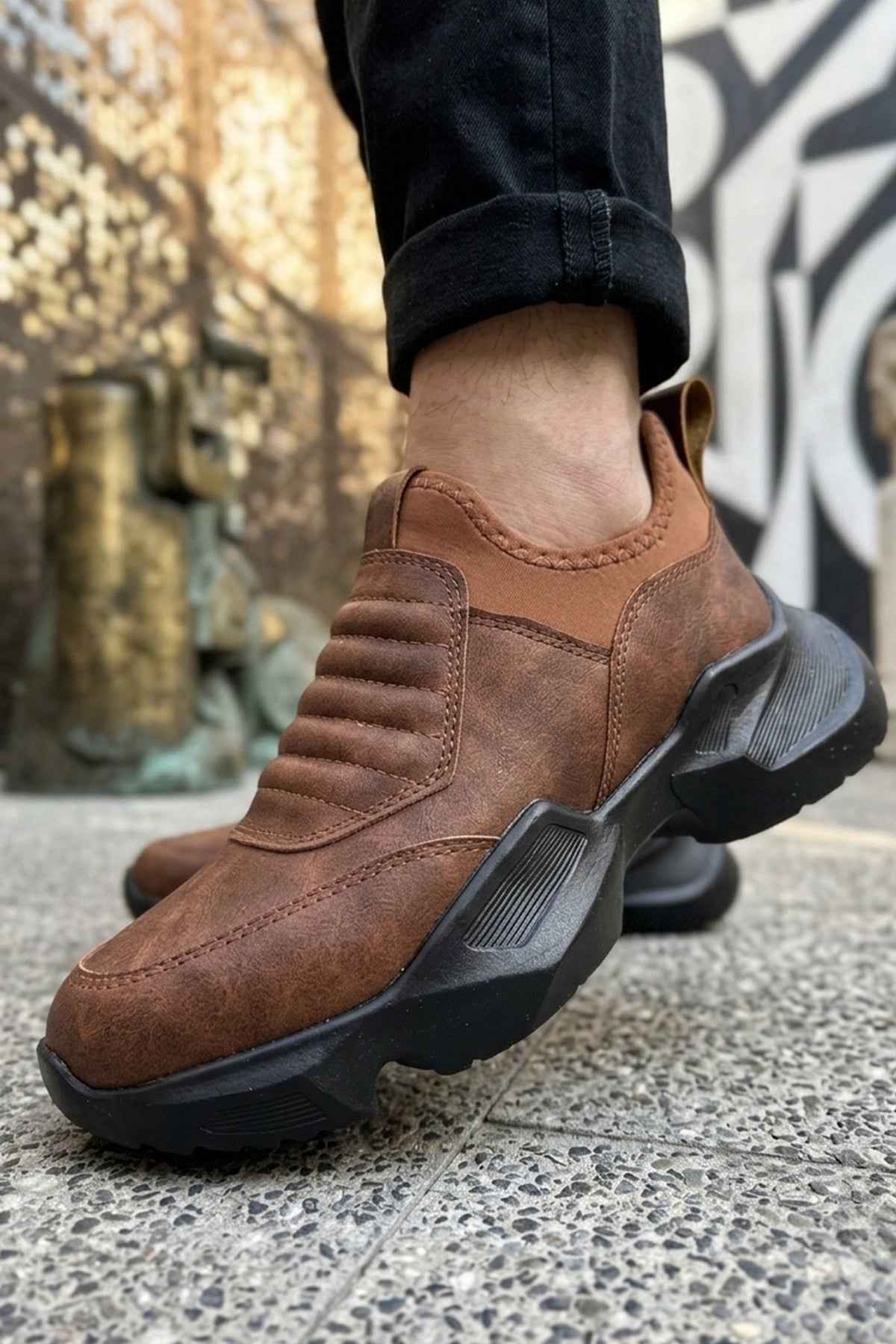 Brown suede sneaker with thick tread sole and elastic side panels