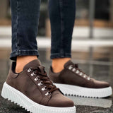 Men's brown lace-up sneakers with white chunky sole and side stitching