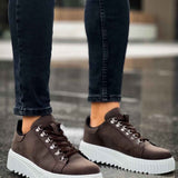 Men's brown low-top sneakers with white rubber sole and lace-up front