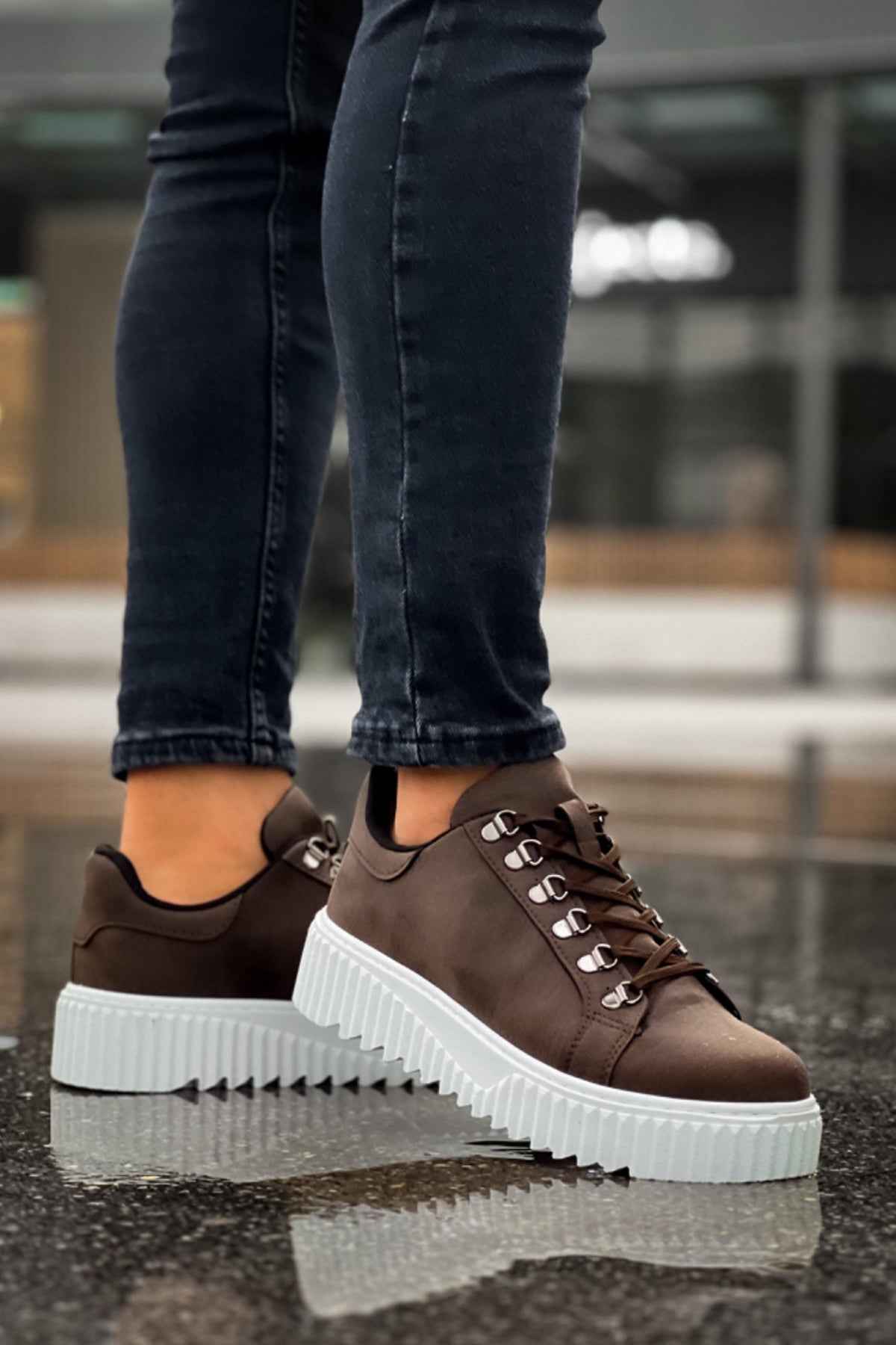 Men's brown sneakers with white chunky sole and lace-up detailing, side view
