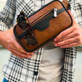 Men's tablet bag with brown leather-look finish, black trim, front zipper, glasses