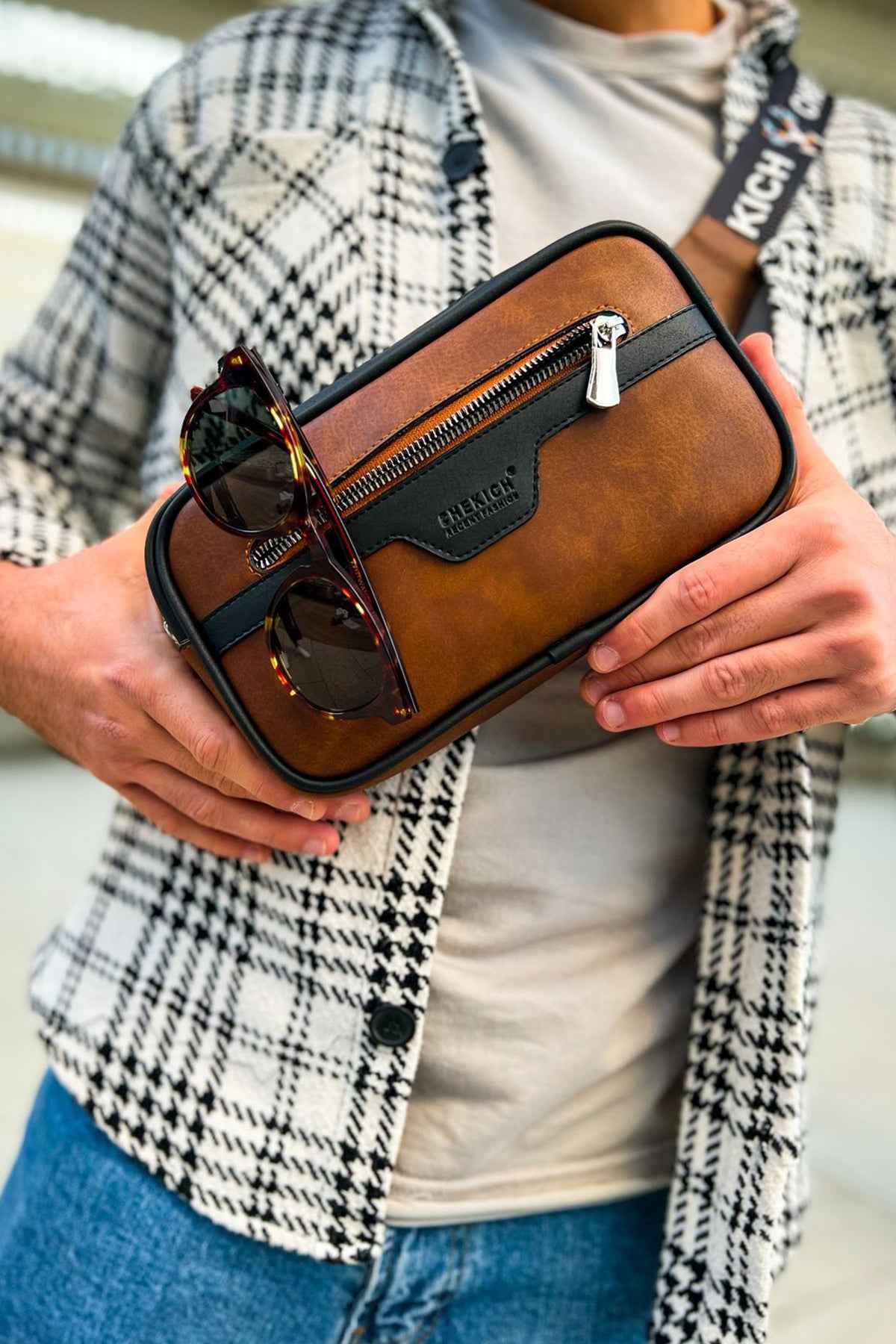 Men's tablet bag with brown leather-look finish, black trim, front zipper, glasses