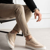 Men's beige canvas sneakers, low-top lace-up with white sole and perforated toe panels.