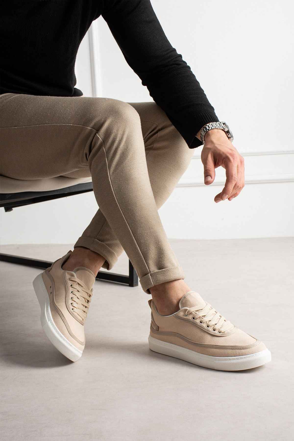 Men's beige canvas sneakers, low-top lace-up with white sole and perforated toe panels.