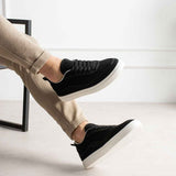 Men's black canvas sneakers with white sole, lace-up style