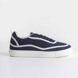 Dark blue canvas lace-up sneakers with white stripe accents and low-profile white sole