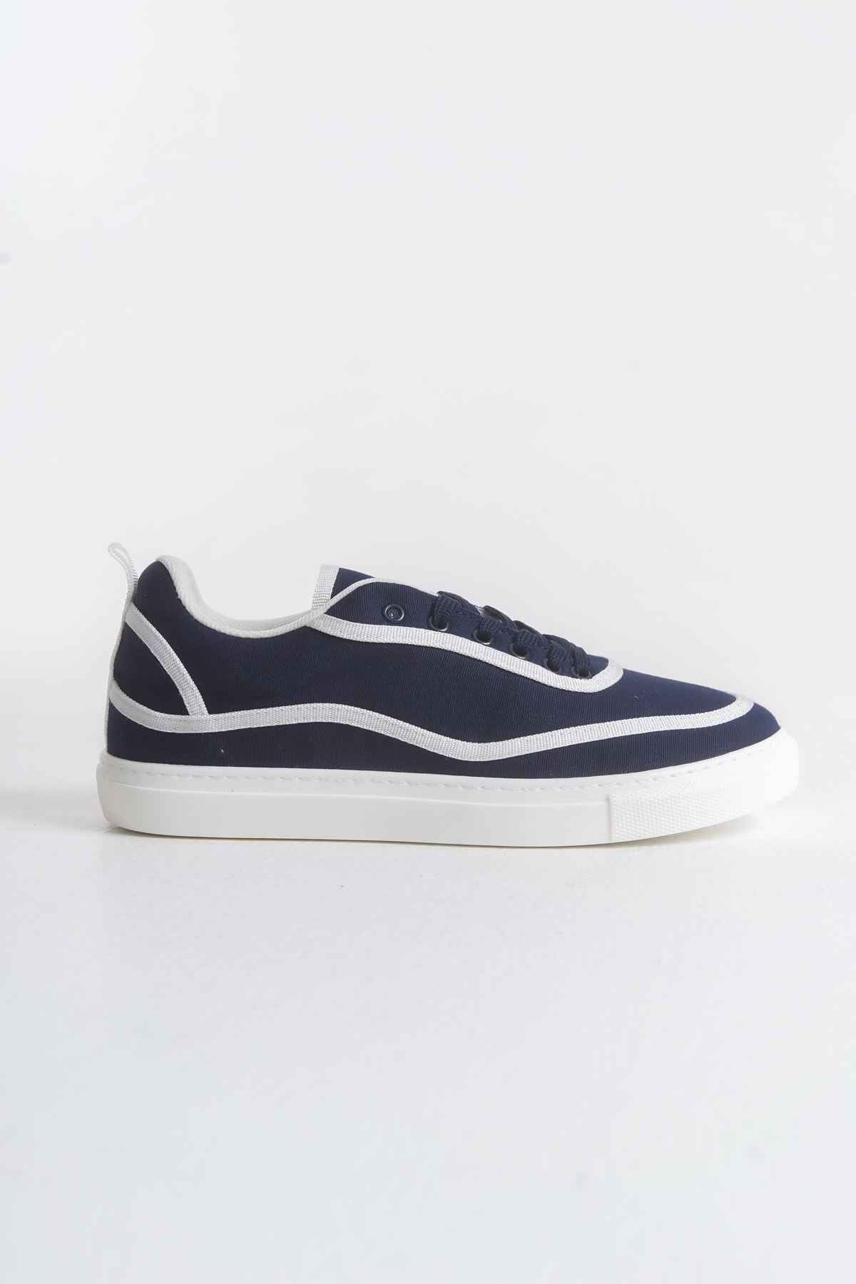 Dark blue canvas lace-up sneakers with white stripe accents and low-profile white sole
