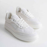White canvas lace-up sneakers with low profile rubber sole