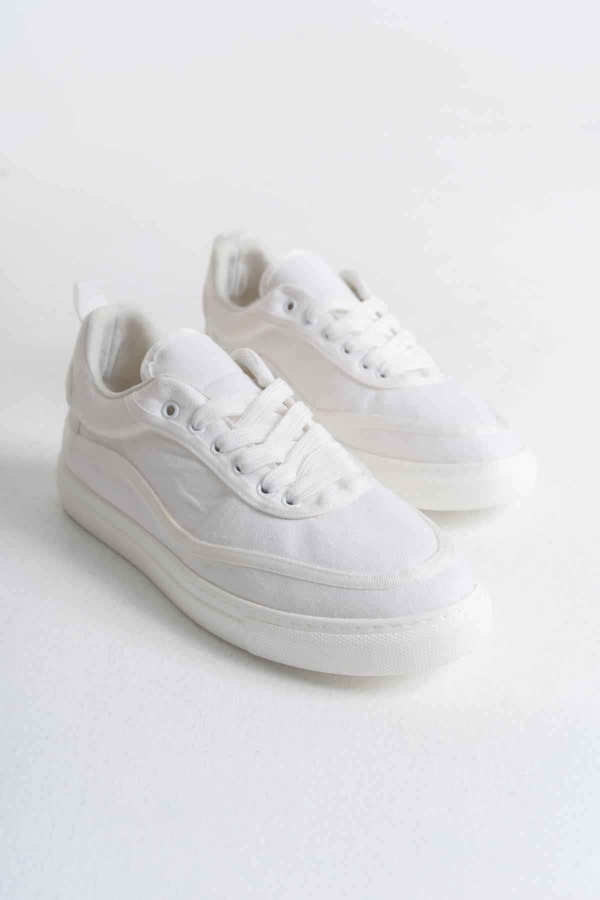 White canvas lace-up sneakers with low profile rubber sole