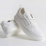 White canvas lace-up sneakers, side and heel view