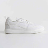 White canvas low-top sneakers with lace-up front