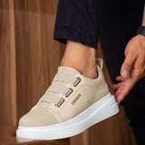 Beige casual sneakers with two adjustable straps and white rubber sole