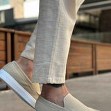 Light beige suede loafers, front-left angle, slip-on style with low white rubber sole
