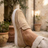 Men's beige suede loafer, close side view with stitched upper