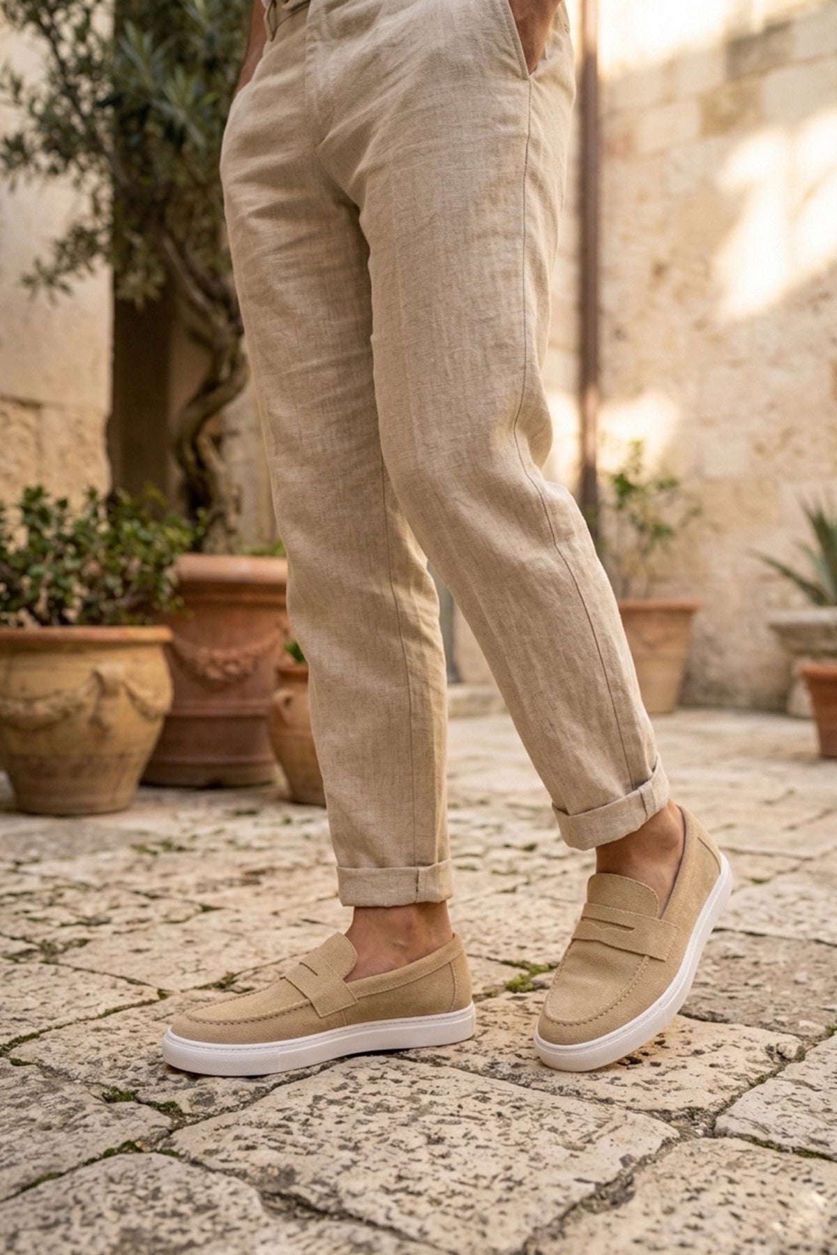 Men's beige suede loafer, standing view with white sole and slip-on design