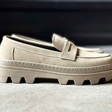 Men's beige suede loafer upper with strap detail and textured rubber sole