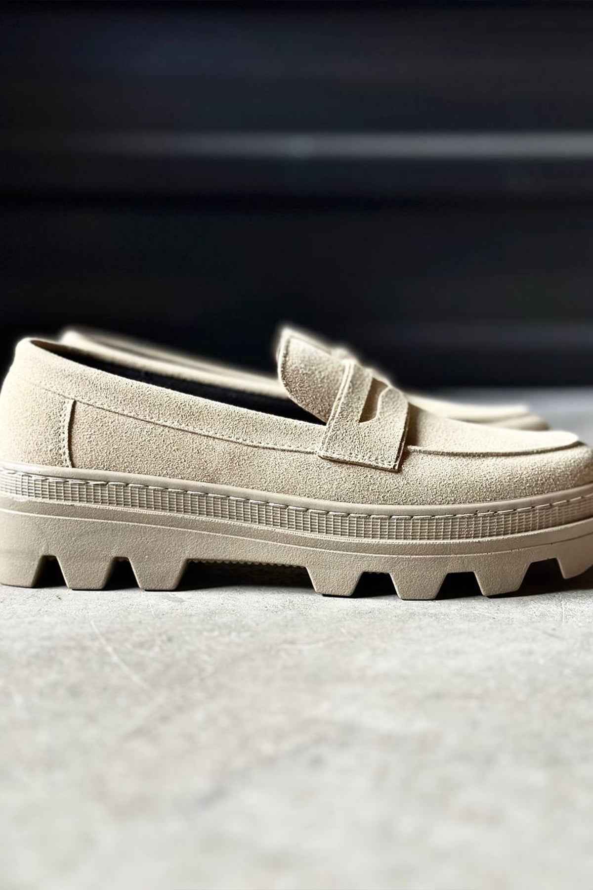 Men's beige suede loafer upper with strap detail and textured rubber sole