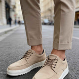 Beige suede lace-up sneakers with white rubber sole, side view