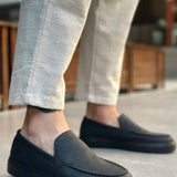 Men's black slip-on loafers, low profile with stitched apron and flat sole