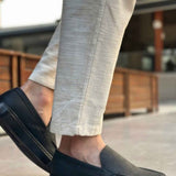 Men's black loafers with side strap detail and stitched apron