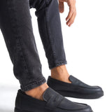 Men's black casual slip-on loafers with strap detail and low-profile sole