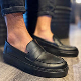 Men's casual black loafers, slip-on style with stitched apron toe and low sole