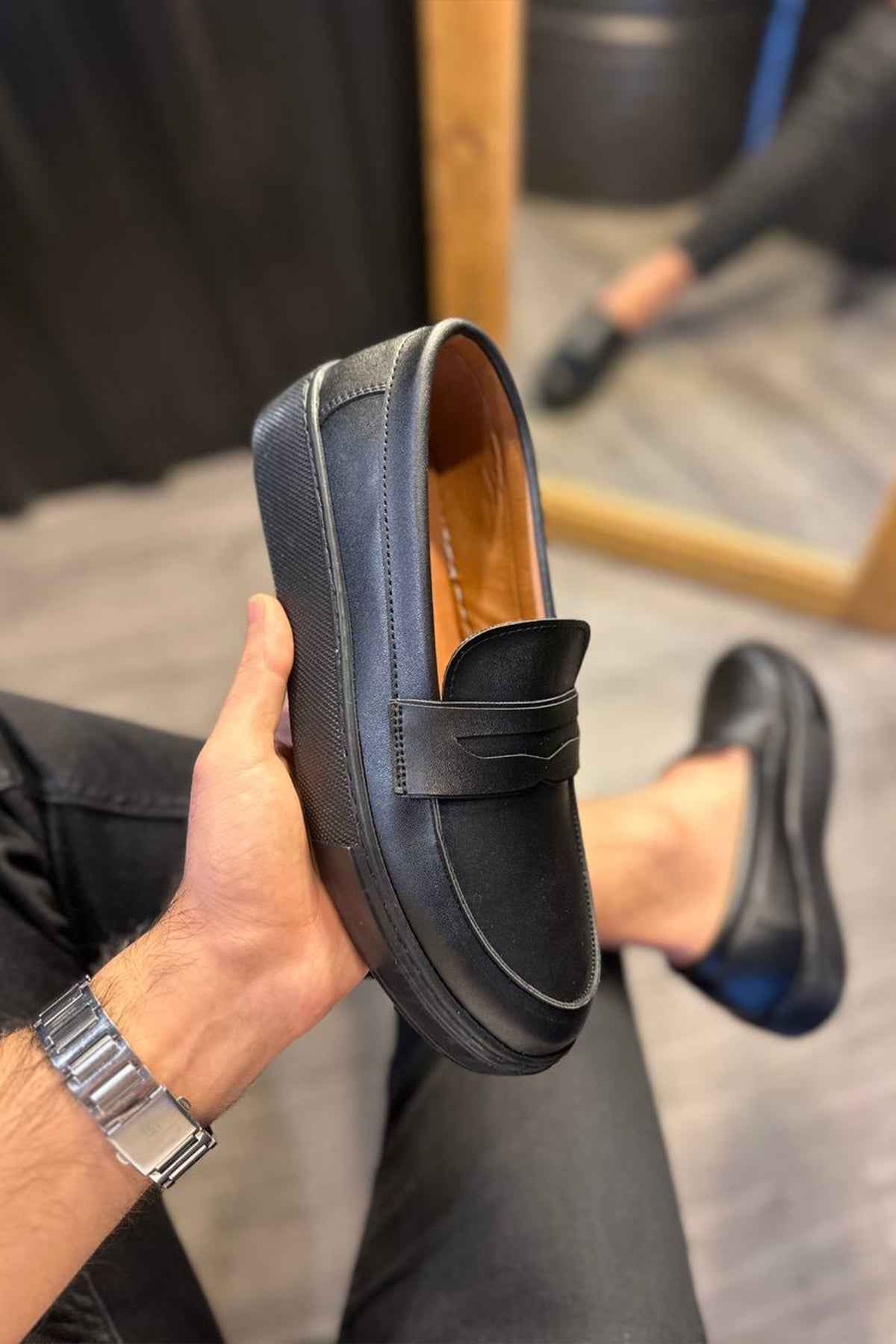 Men's casual black loafers, heel view of slip-on with padded collar