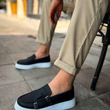 Men's black leather-look loafers with buckle strap and light blue rubber sole