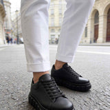 Men's casual black sneakers with lace-up vamp and thick rubber sole